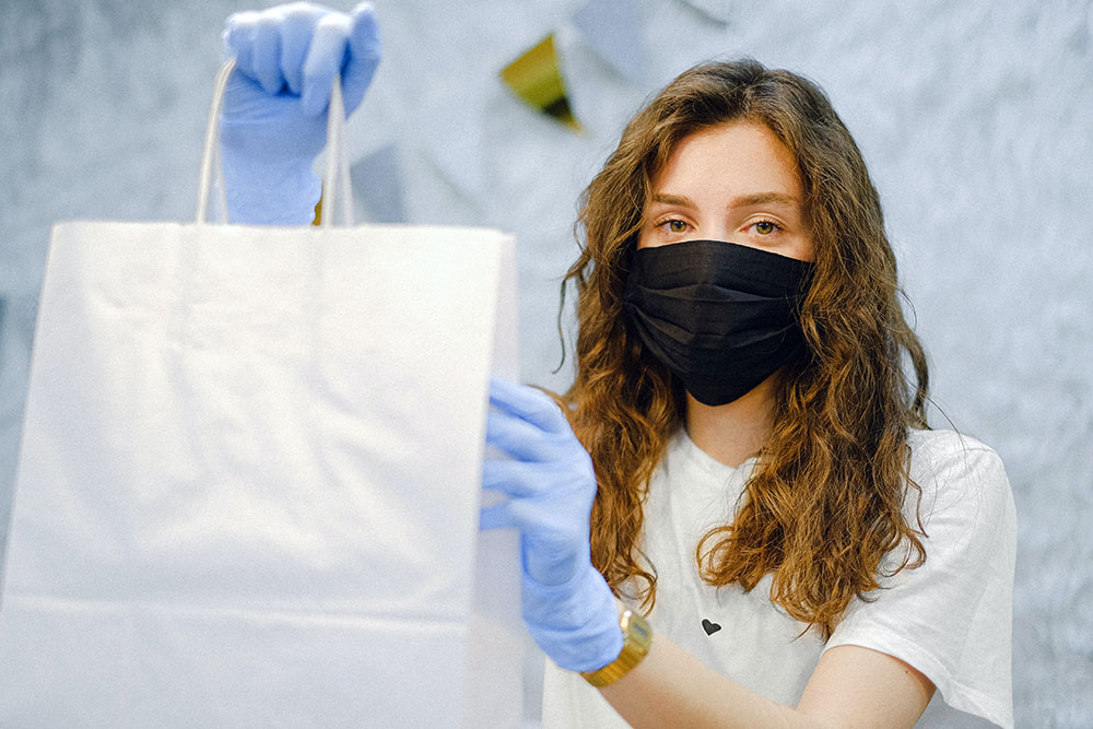 woman wearing protective equipment covid 19 australia