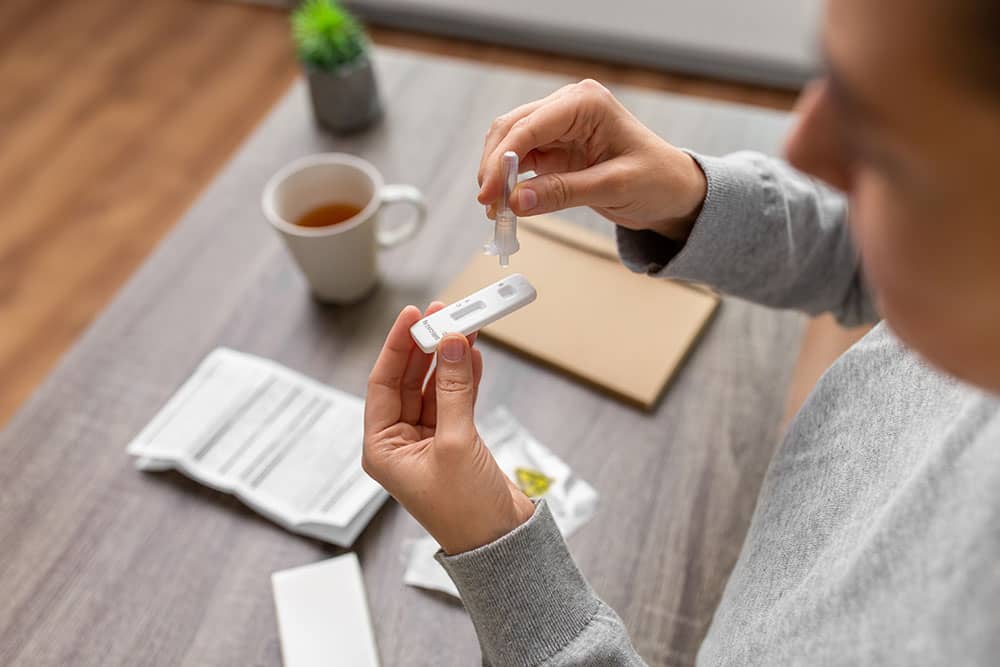 person taking Rapid Antigen test for covid