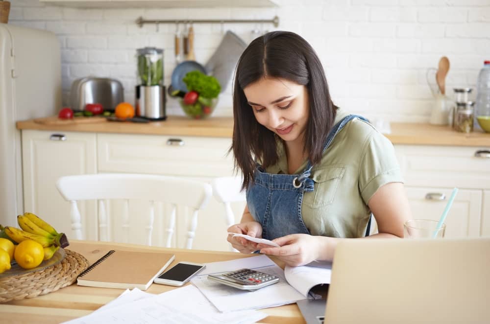 Young woman happy with savings.