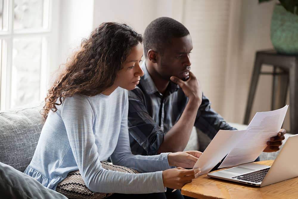 young married couple worried about money