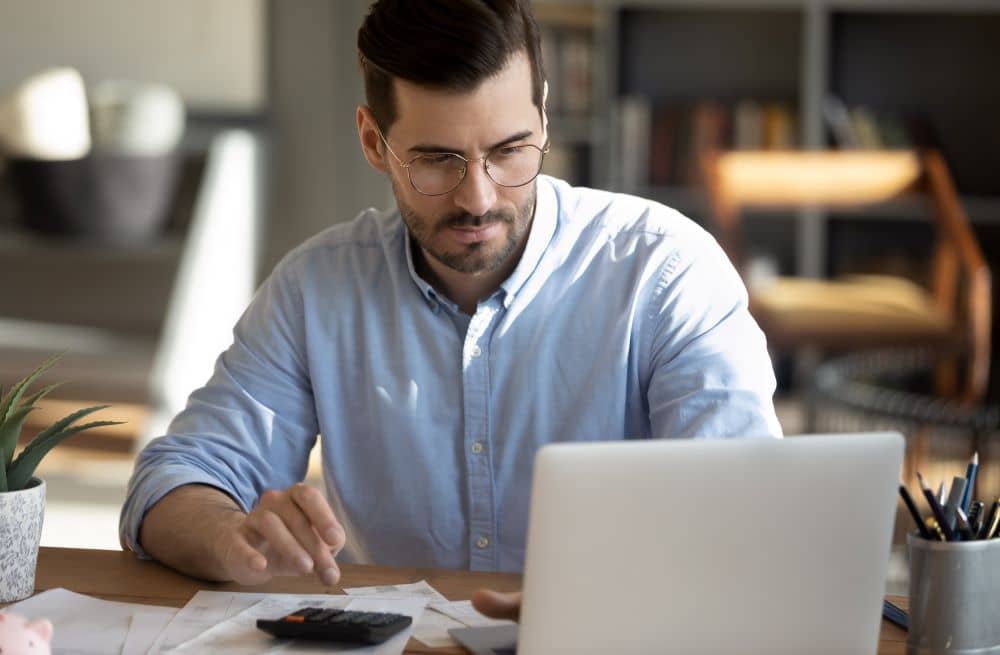 Man calculating expenses.